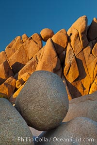 Boulders and sunset in Joshua Tree National Park.  The warm sunlight gently lights unusual boulder formations at Jumbo Rocks in Joshua Tree National Park, California