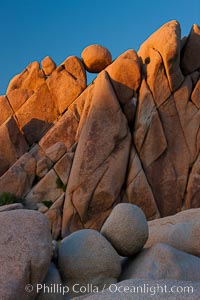 Boulders and sunset in Joshua Tree National Park.  The warm sunlight gently lights unusual boulder formations at Jumbo Rocks in Joshua Tree National Park, California
