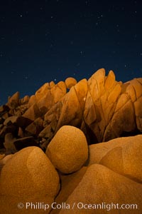 Boulders and stars, moonlight in Joshua Tree National Park. The moon gently lights unusual boulder formations at Jumbo Rocks in Joshua Tree National Park, California