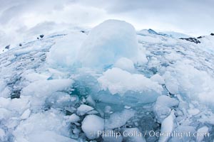 Brash ice and pack ice in Antarctica.  Brash ices fills the ocean waters of Cierva Cove on the Antarctic Peninsula.  The ice is a mix of sea ice that has floated near shore on the tide and chunks of ice that have fallen into the water from nearby land-bound glaciers