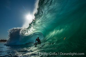 Sponger and backlit barrel, The Wedge, Newport Beach, California