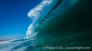 Breaking wave, morning, barrel shaped surf, California