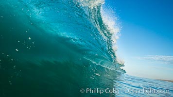 Breaking wave, morning, barrel shaped surf, California