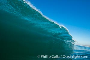 Breaking wave, morning, barrel shaped surf, California