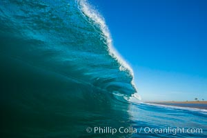 Breaking wave, morning, barrel shaped surf, California.