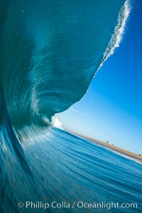 Breaking wave, morning, barrel shaped surf, California