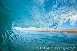 Breaking wave, morning, barrel shaped surf, California