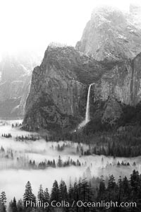 Bridalveil Falls and Yosemite Valley on a misty spring morning.  Yosemite National Park, California.