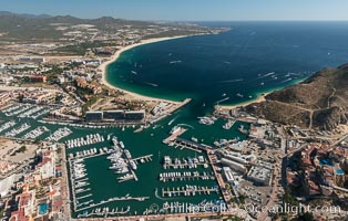 Cabo San Lucas, marina and downtown, showing extensive development and many resorts and sport fishing boats