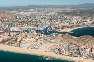 Cabo San Lucas, marina and downtown, showing extensive development and many resorts and sport fishing boats