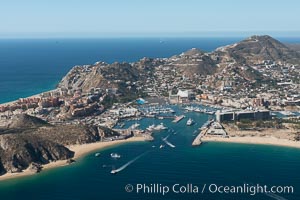 Cabo San Lucas, marina and downtown, showing extensive development and many resorts and sport fishing boats