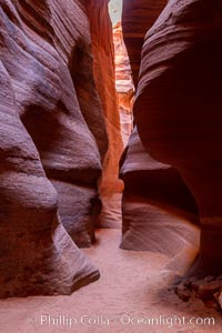 Canyon X, a spectacular slot canyon near Page, Arizona.  Slot canyons are formed when water and wind erode a cut through a (usually sandstone) mesa, producing a very narrow passage that may be as slim as a few feet and a hundred feet or more in height