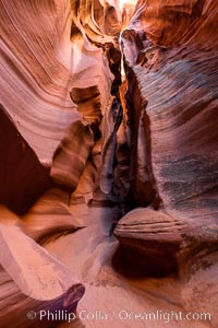 Canyon X, a spectacular slot canyon near Page, Arizona.  Slot canyons are formed when water and wind erode a cut through a (usually sandstone) mesa, producing a very narrow passage that may be as slim as a few feet and a hundred feet or more in height