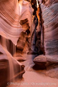 Canyon X, a spectacular slot canyon near Page, Arizona.  Slot canyons are formed when water and wind erode a cut through a (usually sandstone) mesa, producing a very narrow passage that may be as slim as a few feet and a hundred feet or more in height