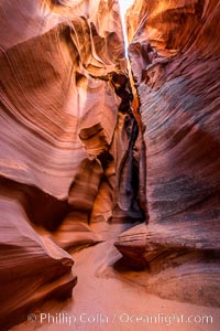 Canyon X, a spectacular slot canyon near Page, Arizona.  Slot canyons are formed when water and wind erode a cut through a (usually sandstone) mesa, producing a very narrow passage that may be as slim as a few feet and a hundred feet or more in height