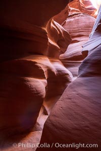 Canyon X, a spectacular slot canyon near Page, Arizona.  Slot canyons are formed when water and wind erode a cut through a (usually sandstone) mesa, producing a very narrow passage that may be as slim as a few feet and a hundred feet or more in height