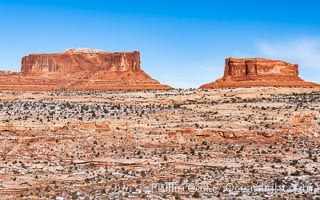 Merrimac Butte (left) and Monitor Butte (right), formed of Entrada sandstone with Carmel and Dewey Bridge formations comprising the basal slope and whiter Navajo sandstone below, Island in the Sky, Canyonlands National Park, Utah