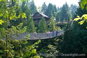 Capilano Suspension Bridge, 140 m (450 ft) long and hanging 70 m (230 ft) above the Capilano River.  The two pre-stressed steel cables supporting the bridge are each capable of supporting 45,000 kgs and together can hold about 1300 people, Vancouver, British Columbia, Canada