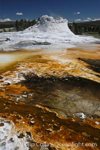Sinter cone of Castle Geyser, estimated to be 5,000 - 15,000 years old.  Tortoise Shell Spring in foreground. Upper Geyser Basin, Yellowstone National Park, Wyoming