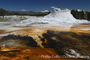 Sinter cone of Castle Geyser, estimated to be 5,000 - 15,000 years old.  Tortoise Shell Spring in foreground. Upper Geyser Basin. Yellowstone National Park, Wyoming, USA, natural history stock photograph, photo id 07212