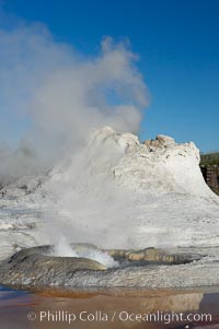 Tortoise Shell Spring bubbles in front of the sinter cone of Castle Geyser.  Upper Geyser Basin, Yellowstone National Park, Wyoming