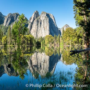 Cathedral Rocks reflected in a meadow flooded by the Merced River, historical snowmelt following record snowfall floods Yosemite Valley in May 2023, Yosemite National Park, California