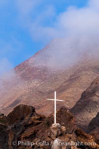 Lighthouse and cross mark the site of a small fishing shack and old chapel and prison near the north end of Guadalupe Island (Isla Guadalupe)