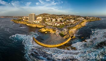 Childrens Pool seawall and Casa Cove aerial photo, La Jolla, California. Sunset. Aerial panoramic photograph