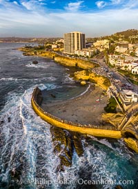 Childrens Pool seawall and Casa Cove aerial photo, La Jolla, California. Sunset. Aerial panoramic photograph