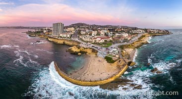 Childrens Pool seawall and Casa Cove aerial photo, La Jolla, California. Sunset. Aerial panoramic photograph