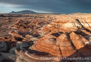 Chinle Formations, formed in the Upper Triassic period, are seen as striations in the deeply eroded Utah badlands