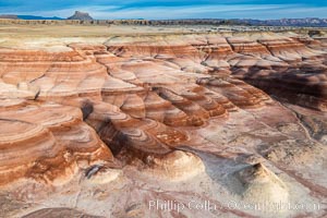 Chinle Formations, formed in the Upper Triassic period, are seen as striations in the deeply eroded Utah badlands