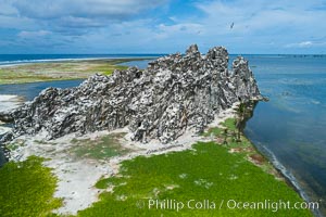 Clipperton Rock, a 95' high volcanic remnant, is the highest point on Clipperton Island, a spectacular coral atoll in the eastern Pacific. By permit HC / 1485 / CAB (France)