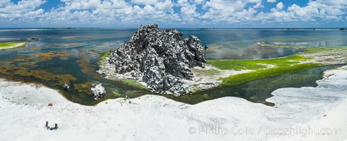 Clipperton Rock, a 95' high volcanic remnant, is the highest point on Clipperton Island, a spectacular coral atoll in the eastern Pacific. By permit HC / 1485 / CAB (France)