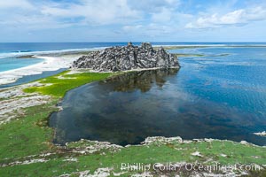 Clipperton Rock, a 95' high volcanic remnant, is the highest point on Clipperton Island, a spectacular coral atoll in the eastern Pacific. By permit HC / 1485 / CAB (France)