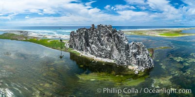 Clipperton Rock, a 95' high volcanic remnant, is the highest point on Clipperton Island, a spectacular coral atoll in the eastern Pacific. By permit HC / 1485 / CAB (France)