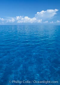 Clouds, ocean and sand plains, no land in sight. Bahamas.