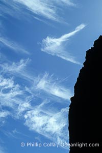Clouds, blue sky and sea cliffs, Guadalupe Island (Isla Guadalupe)