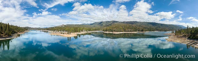 Clouds reflected on calm Bass Lake, aerial photo, panorama