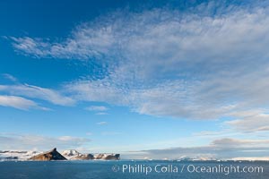 Clouds and rugged Antarctic coastline, Devil Island