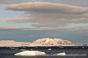 Clouds and rugged Antarctic coastline, Devil Island