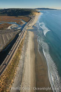 Coast Highway 101, looking south from Del Mar, with Los Penasquitos Marsh on the left and the cliffs of Torrey Pines State Reserve and La Jolla in the distance, San Diego, California