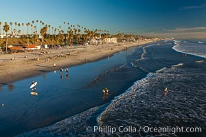 The coast of Oceanside California, waves and surfers, beach houses, just before sunset, winter, looking south, Oceanside Pier