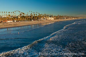 The coast of Oceanside California, waves and surfers, beach houses, just before sunset, winter, looking south, Oceanside Pier