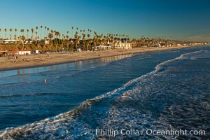 The coast of Oceanside California, waves and surfers, beach houses, just before sunset, winter, looking south, Oceanside Pier