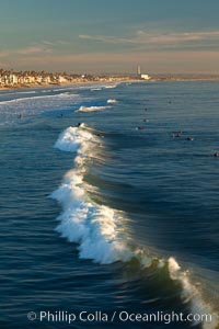 The coast of Oceanside California, waves and surfers, beach houses, just before sunset, winter, looking south, Oceanside Pier