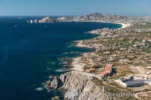 Punta Ballena, Faro Cabesa Ballena (foreground), Medano Beach and Land's End (distance). Residential and resort development along the coast near Cabo San Lucas, Mexico