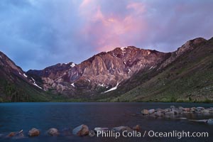 Sunrise and storm clouds over Convict Lake and Laurel Mountain, Eastern Sierra Nevada, California.