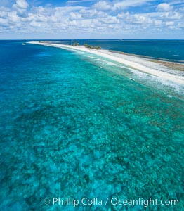 Coral Reef at Clipperton Island, aerial photo. Clipperton has healthy, beatiful coral reefs.  The white beaches are composed of white coralline rubble. Clipperton Island, a minor territory of France also known as Ile de la Passion, is a spectacular coral atoll in the eastern Pacific. By permit HC / 1485 / CAB (France)