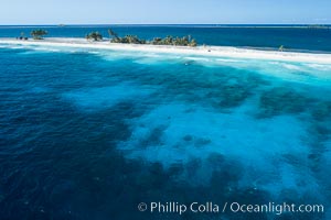 Coral Reef at Clipperton Island, aerial photo. Clipperton has healthy, beatiful coral reefs.  The white beaches are composed of white coralline rubble. Clipperton Island, a minor territory of France also known as Ile de la Passion, is a spectacular coral atoll in the eastern Pacific. By permit HC / 1485 / CAB (France)